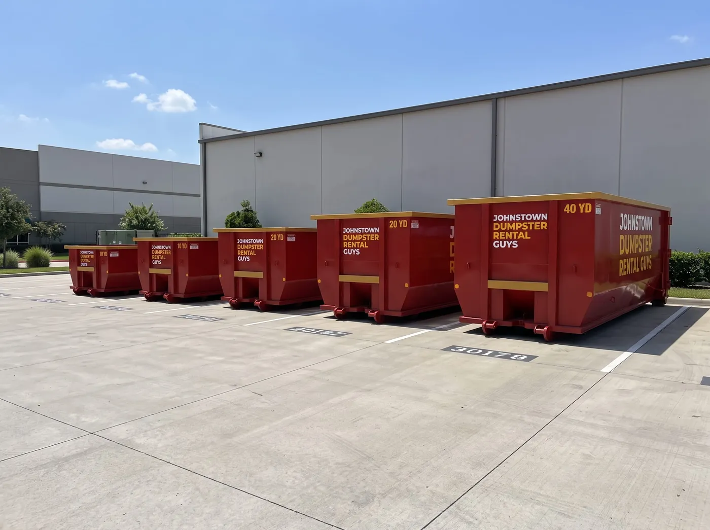 Johnstown Dumpster Rental Guys roll-off truck fleet parked at the Johnstown yard